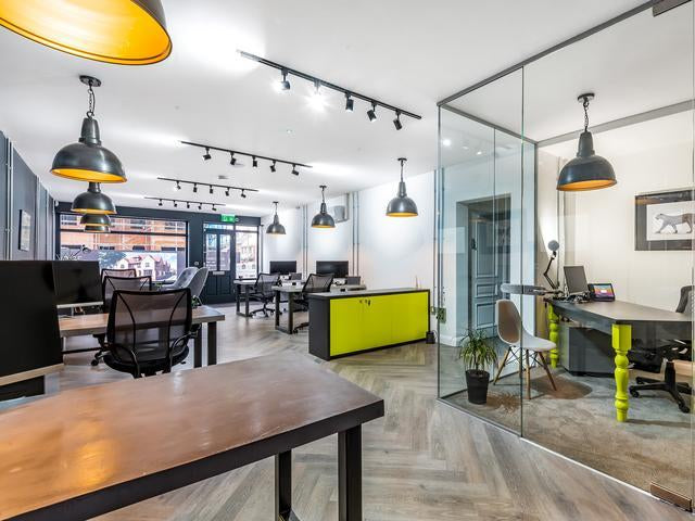 A modern office with industrial pendant lights