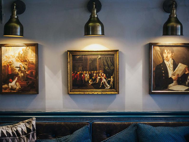 Star and Garter restaurant interior with navy decor, unique wall art and industrial wall lights