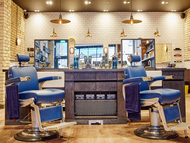 A hairdressers salon and barbers decorated with industrial pendant lights