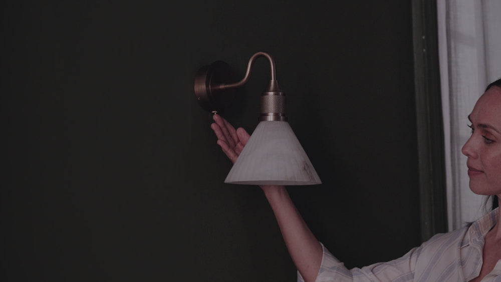 Noho Alabaster 7 Inch Fluted Funnel Swan Neck Wall Light gets switched on